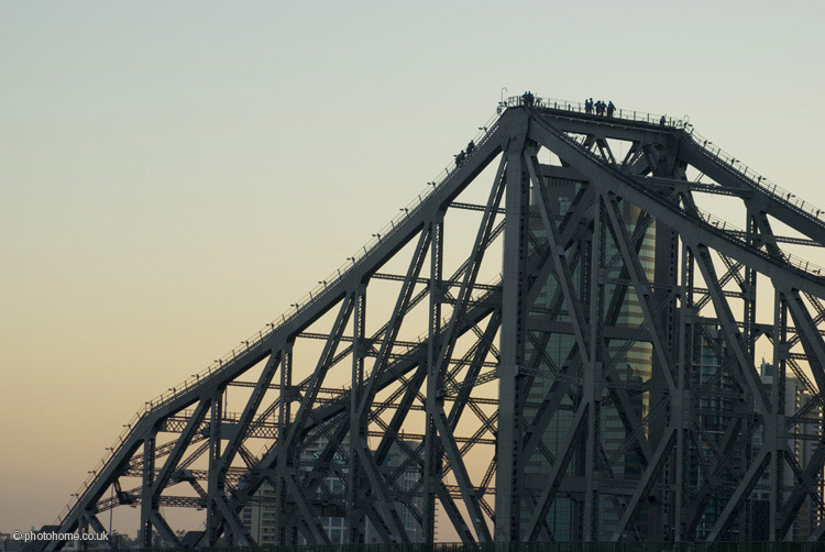 story bridge climbers on the story bridge at sunset