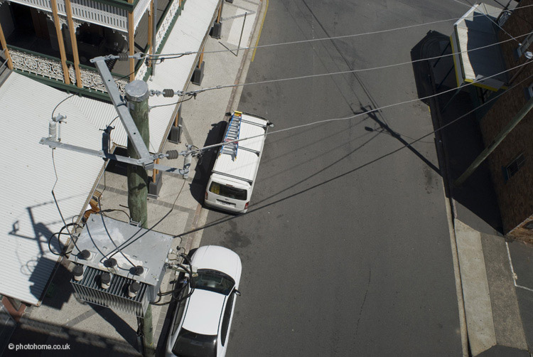 looking down on a bridbane street and power transformer